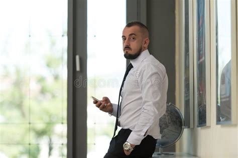 Business Man Texting On Cellphone In Modern Office Stock Photo Image