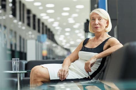 Businesswoman Sitting At Office Hall