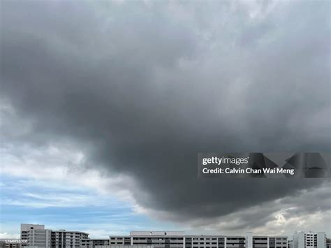 Storm Cloud Forms Against Bright And Clear Blue Sky High-Res Stock Photo - Getty Images