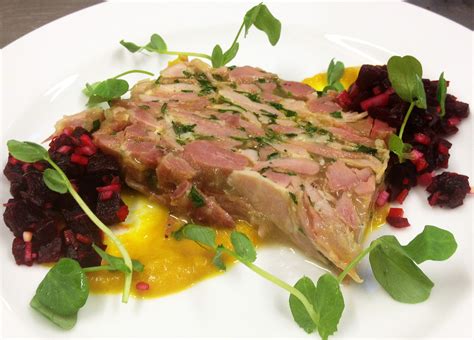 Ham hock terrine with beetroot relish, piccalilli sauce and pea shoots