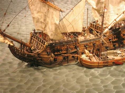 Three Wooden Model Ships On Display In A Museum