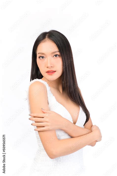 Portrait Of Young Beautiful Sexy Asian Woman Wearing A White Dress Pose