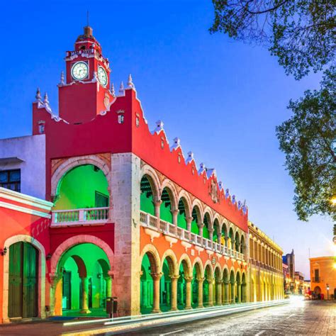 Red Colonial Building Lit By Green Lights In Old Town Merida Yucatan