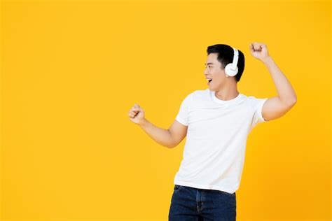 Premium Photo Young Handsome Asian Man Wearing Headphones Listening