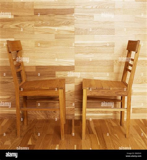 Wooden Chairs By A Wooden Wall And Parquet Floor Stock Photo Alamy