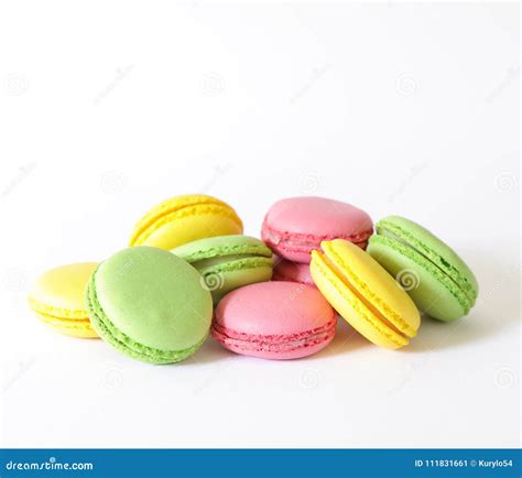 Three Different Types Of Macaroons Colors Pink Green And Yellow