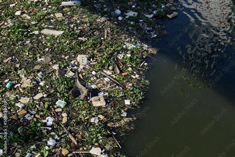 Aerial view of trash polluting the Saigon river, downtown Ho Chi Minh ...