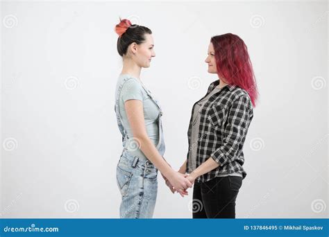 Two Girls Hug On A White Background Homosexual Lesbian Couple Casual