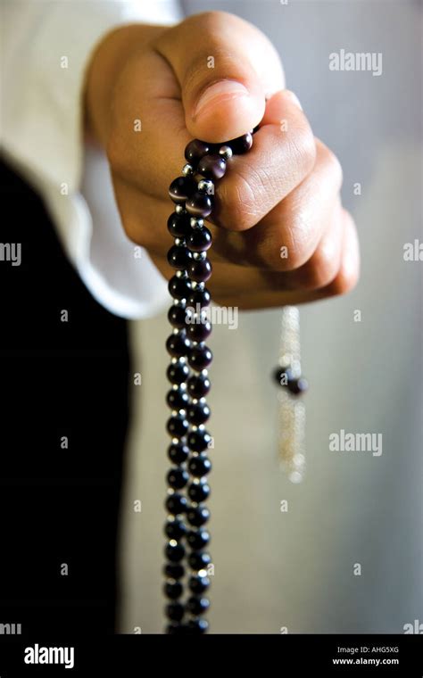 Hands Holding Prayer Beads Stock Photo Alamy