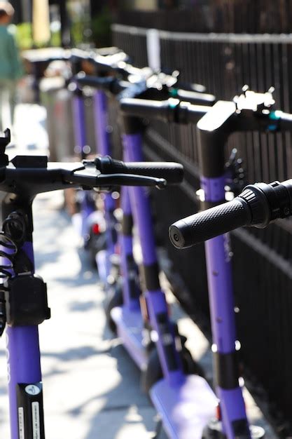 Premium Photo Parked Scooters On The Street