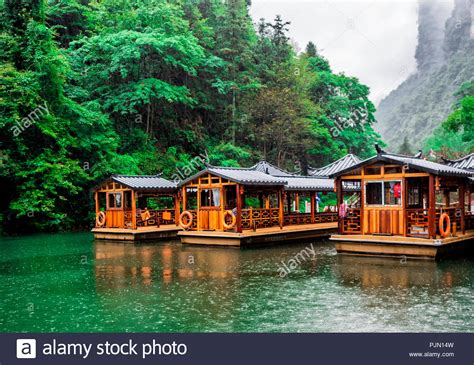 Baofeng Lake Boat Trip In A Rainy Day With Clouds And Mist At