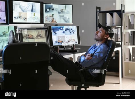 Security guard sleeping in surveillance room Stock Photo - Alamy