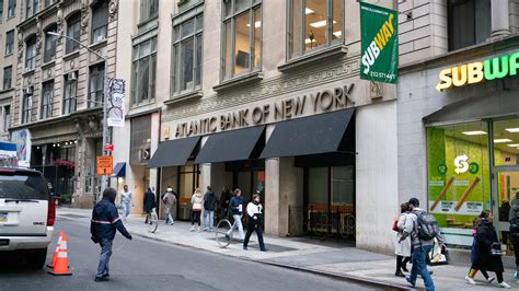 NYCB Shares Slide After Losses Deepen - The New York Times