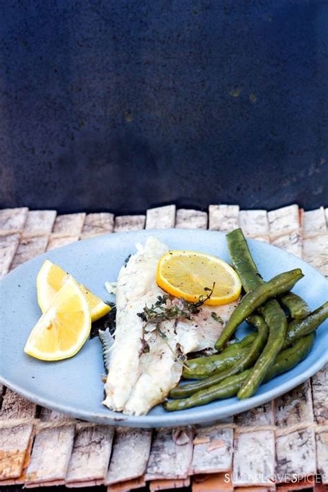 Grilled Branzino stuffed with lemon and herbs - SugarLoveSpices