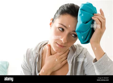 Woman Using Hot Water Bottle Stock Photo Alamy