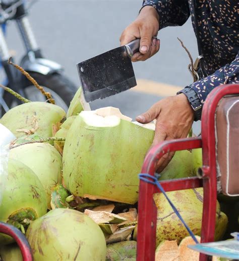 Coconut is Cut with a Knife for Drinking Milk Stock Photo - Image of ...