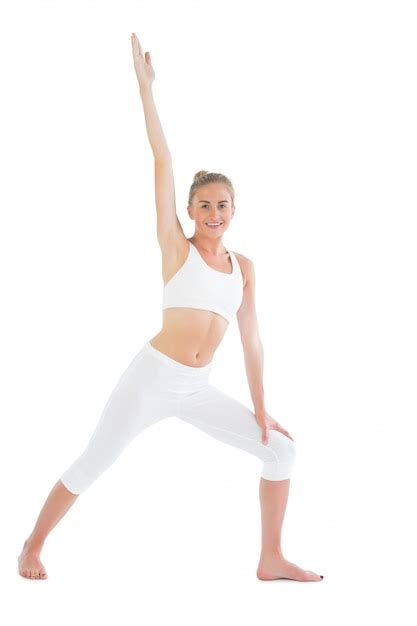 Premium Photo Toned Smiling Blonde Doing Yoga Exercise