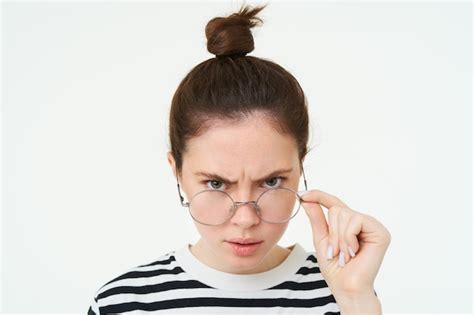 Free Photo Portrait Of Angry Woman Looks From Under Forehead Takes