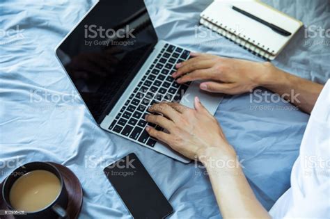 Man Working In Bed Stock Photo - Download Image Now - Adult, Adults ...