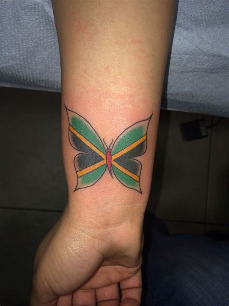 My Jamaican flag butterfly tattoo on my wrist sooo in love! | Jamaican ...