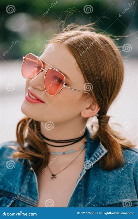 Portrait Of Beautiful Smiling Girl In Sunglasses And Denim Jacket