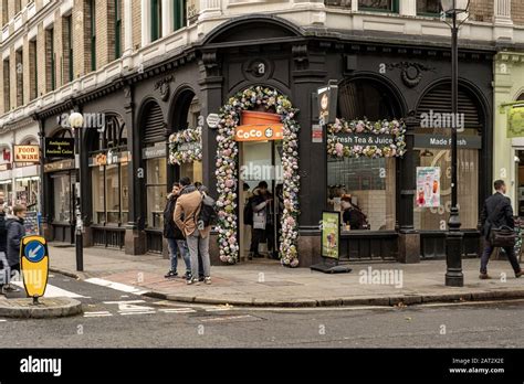 London / UK - Nov 28, 2019: people walking past the Coco Fresh Tea ...