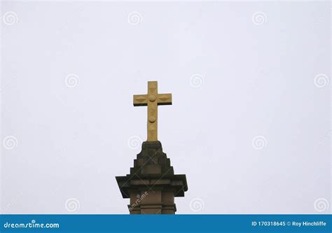 Large Gold Coloured Cross On Stone Plinth Stock Image Image Of Book