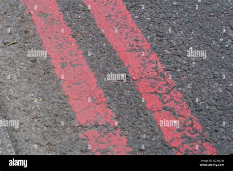 Double Red Lines On A Red Route In London Stock Photo Alamy