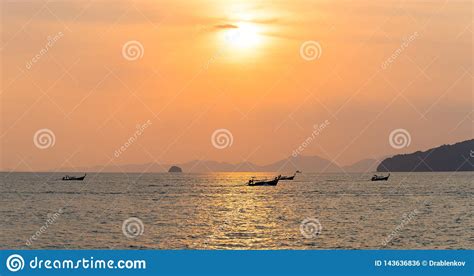 Panorama Of Local Thai Longtail Motor Boats Under Golden Sun In The Sea