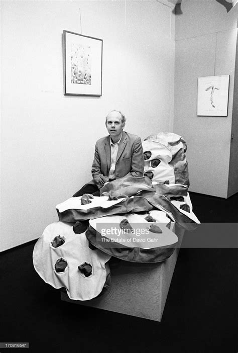 Artist and sculptor Claes Oldenburg poses for a portrait with his large-scale soft sculpture ...