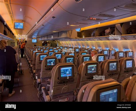 Interior Of Plane As Passengers Start To Board An Emirates Evening