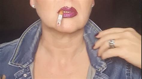 Smoker MILF In Denim With Big Clevage Smokes Close Up Naughty Seductive Her Camel Sunglasses