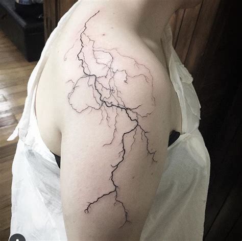 Lightning Bolt Tattoo On Woman S Shoulder