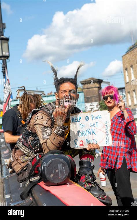 Punk posing for pictures and entertaining tourists in Camden Town ...