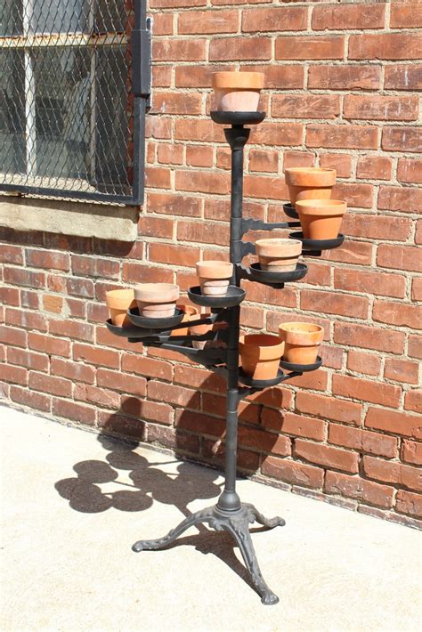 Antique Tiered Cast Iron Plant Stand With Grouping Of Terra Cotta Pots