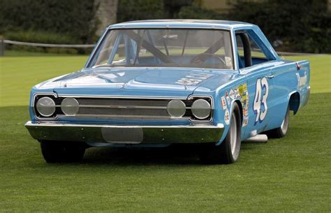 An Old Race Car Is Parked On The Grass