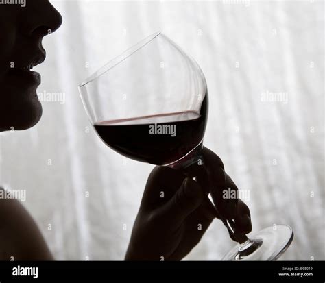 Woman drinking wine Stock Photo - Alamy