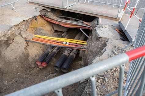 Cables Are Crossing And Buried Underground On The Street Underground