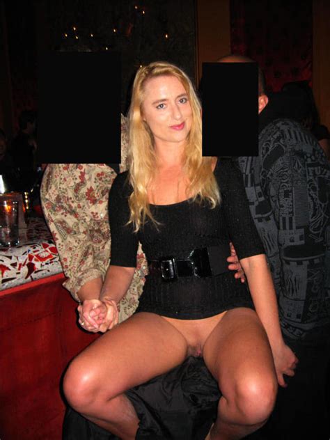 Showing Off Her Bottomless Pussy In A Short Dress Inside A Bar