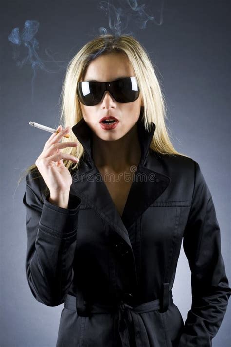 Blond Woman Holding A Cigarette Stock Image Image 12443691