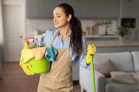 Premium Photo Content Woman With Cleaning Equipment Ready For Chores