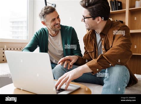 Happy Gay Couple Using Laptop Hi Res Stock Photography And Images Alamy