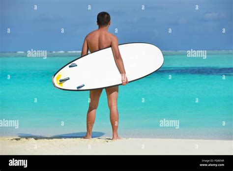 Man With Surf Board On Beach Stock Photo Alamy