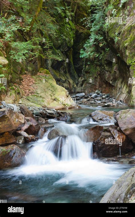 Alpine waterfall with motion blur Stock Photo - Alamy