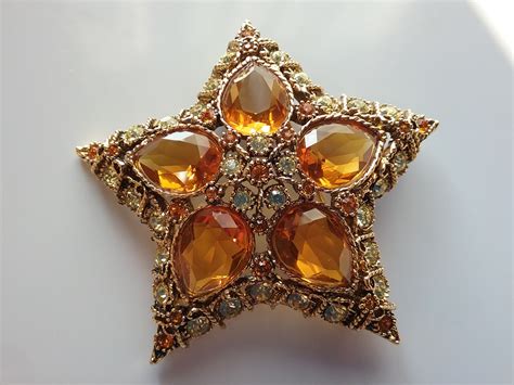 kjl star brooch collectors weekly