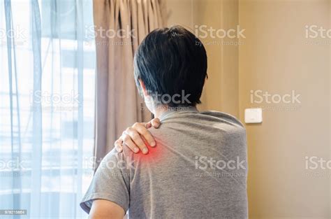 Man Waking Up In The Morning And Suffering From Shoulder Pain Stock