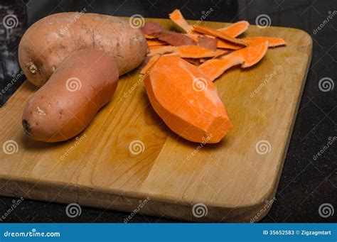 Sweet Potaoes Peeled On Cutting Board Stock Image Image Of Orange