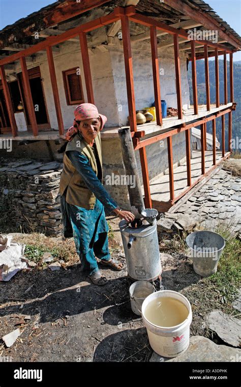 Woman Boiling Water In Front Of Her House Matiyama Himachal Pradesh