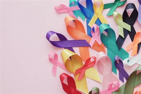 Premium Photo | Colorful ribbons on pink background, cancer awareness ...