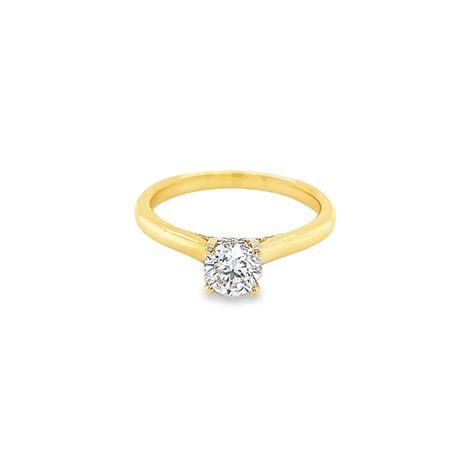 Round Brilliant Solitaire Diamond Engagement Ring With Hidden Halo